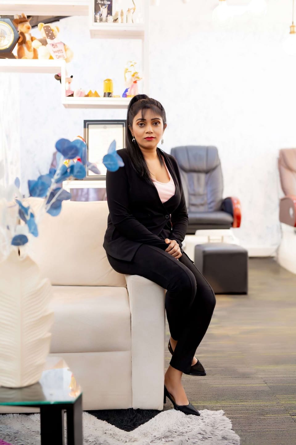 Jaya Samarasinghe, founder of Beauty Nail Spa, seated in the salon